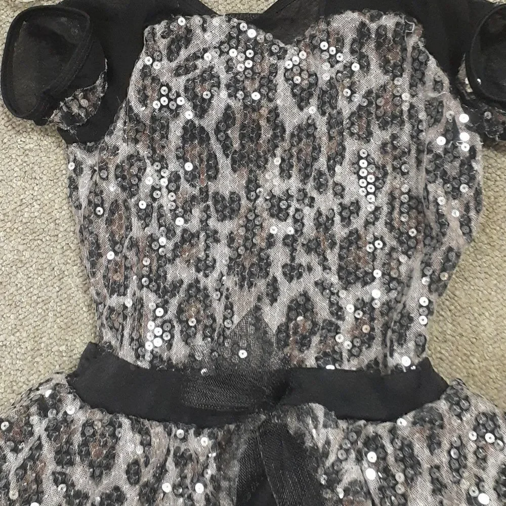 Beautiful leopard black and pink dance leotard and black tights‎ to go with it.